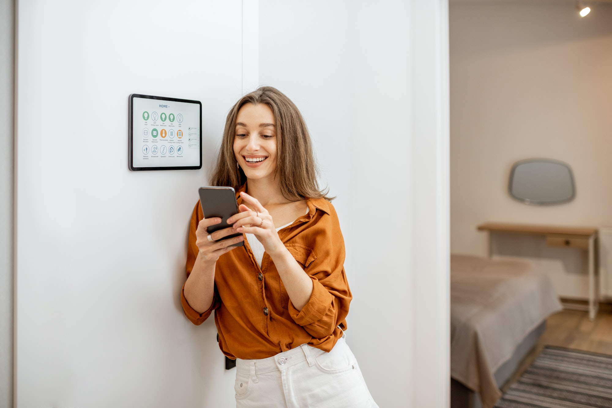 portrait-of-a-happy-woman-controlling-smart-home.jpg